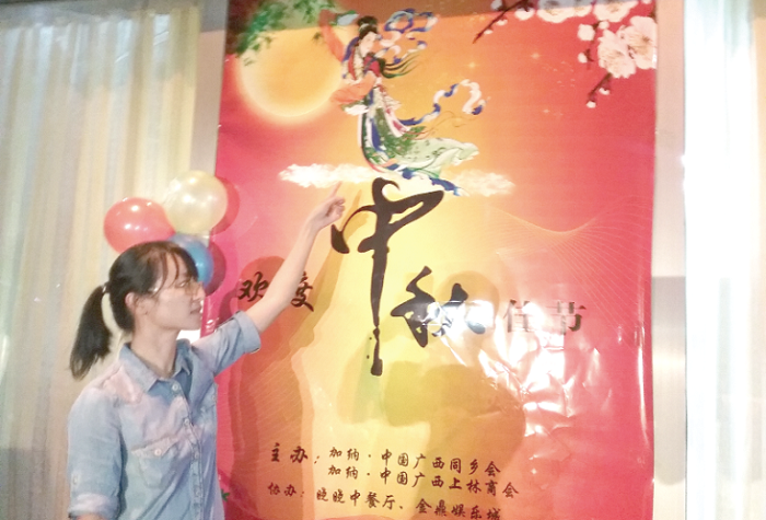 Monica Wei explaining pictorial symbols relating to romanticism, peace and good luck attached to the celebration of the Moon Festival Monica Wei explaining pictorial symbols relating to romanticism, peace and good luck attached to the celebration of the Moon Festival